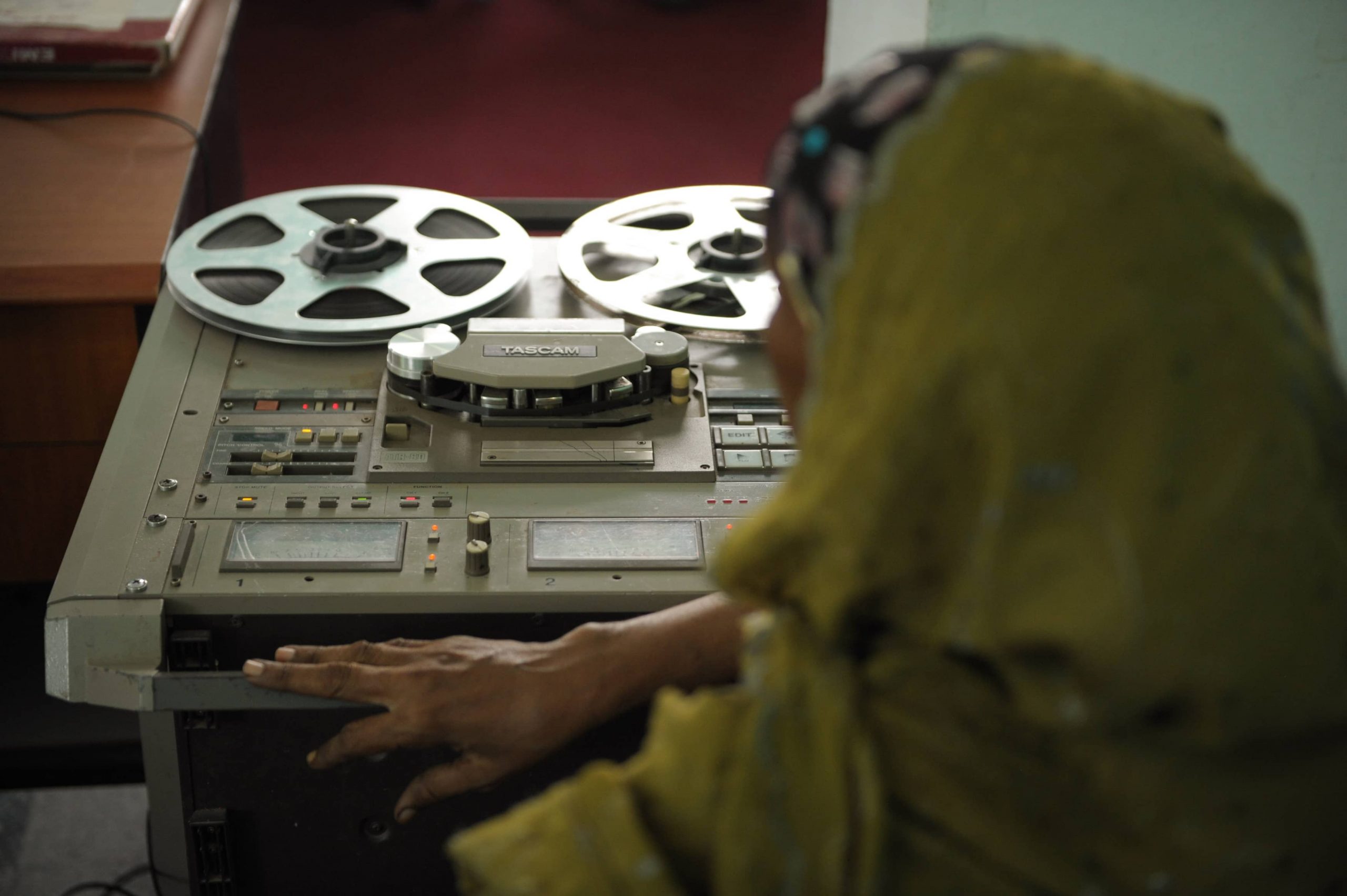 Image shows a Radio Mogadishu employee digitising the archive's recordings (Mogadishu, Somalia).